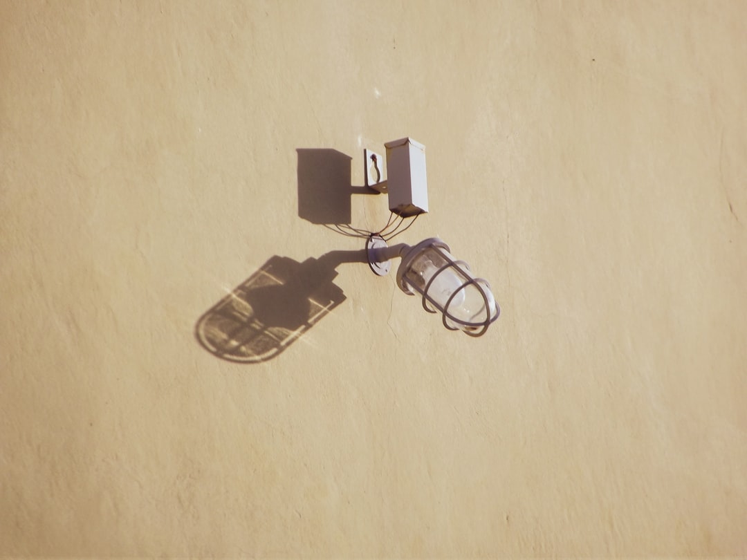 black framed eyeglasses on brown wooden table