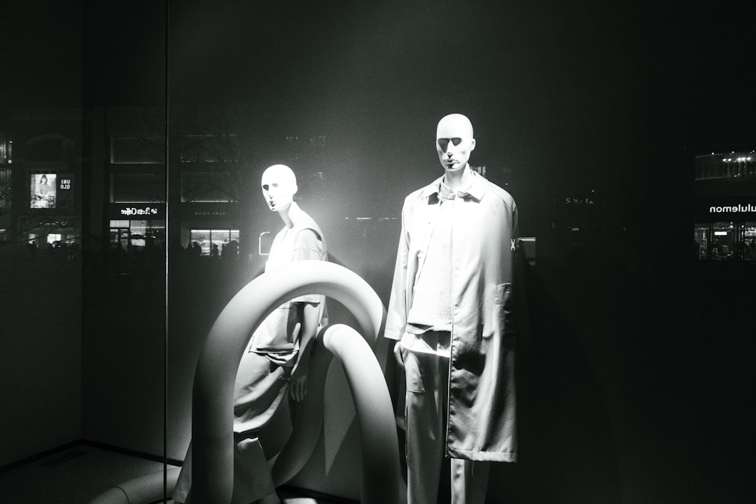 a couple of mannequins standing next to each other