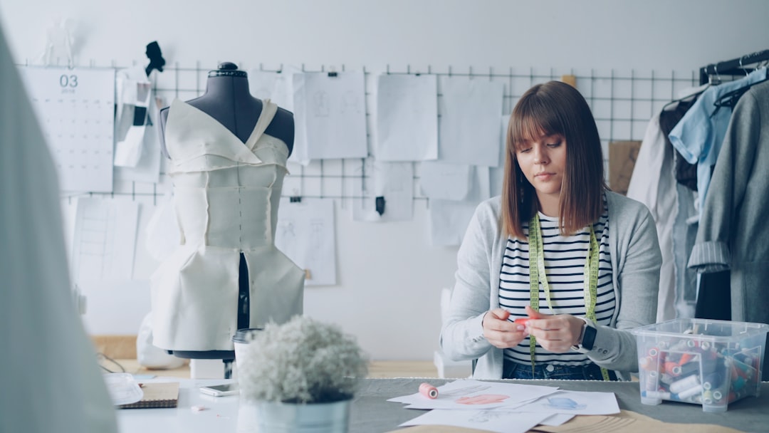 A fashion designer works in her studio.